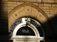 2025.68.54: Salts Hospital front door window in lowlight. Digital image credit: Saltaire Collection
